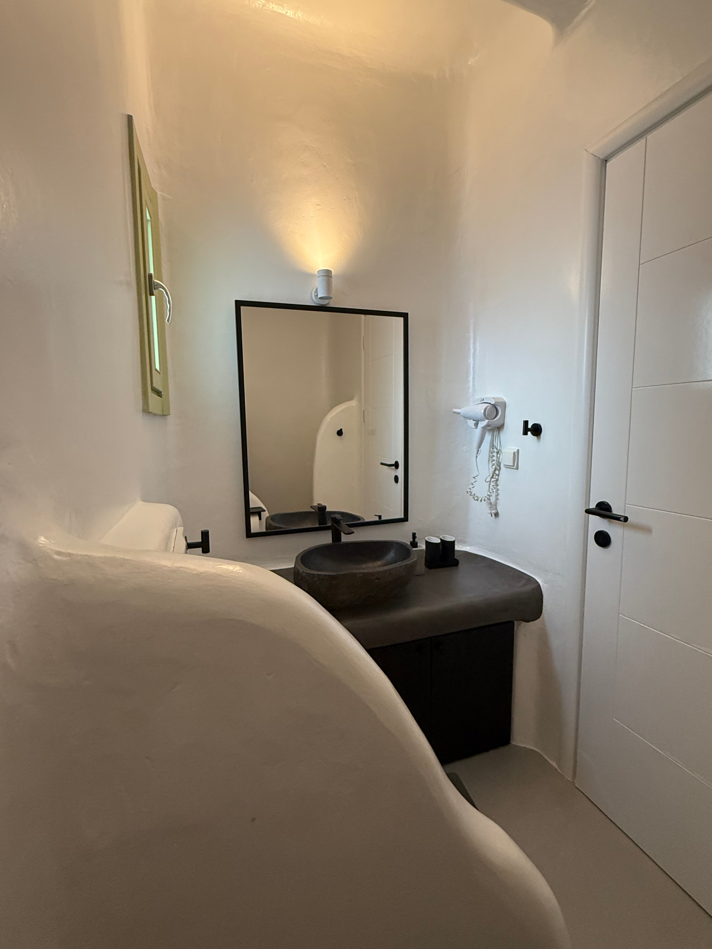 Villa AGNES bathroom with stone sink and black fixtures